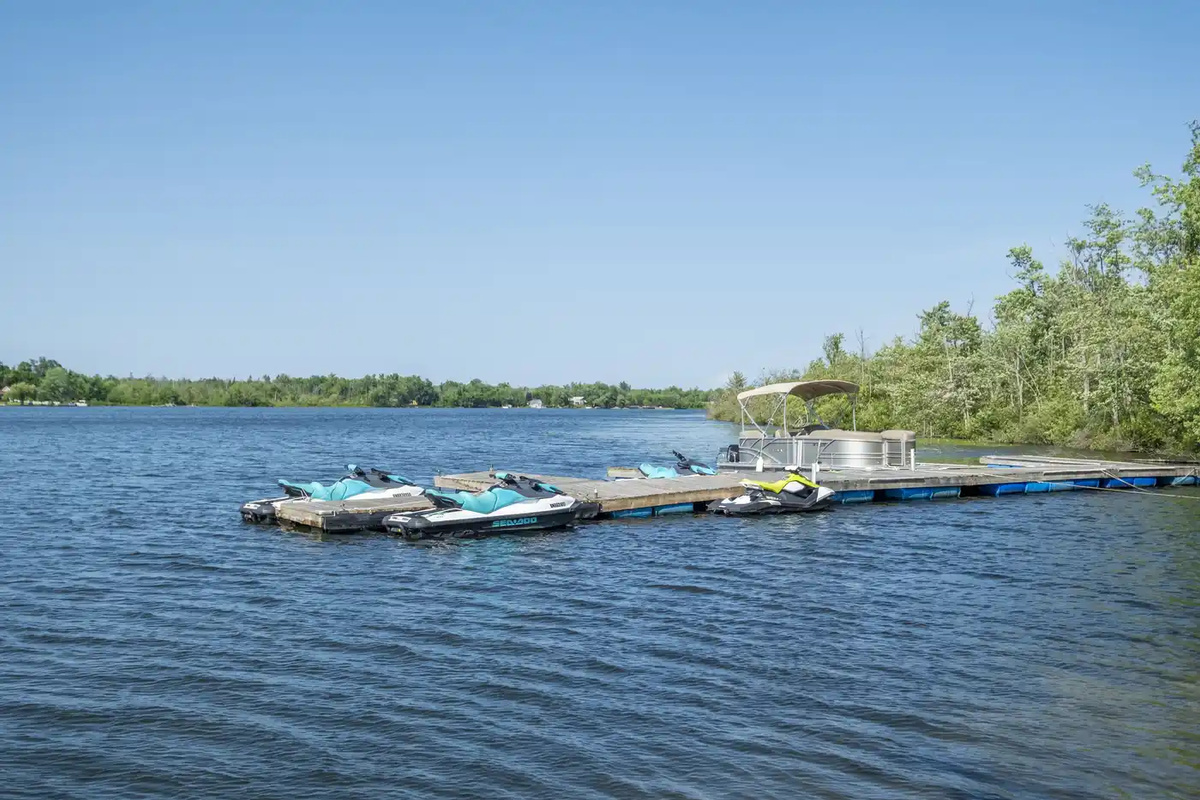 Waterfront dock with boats and open water views