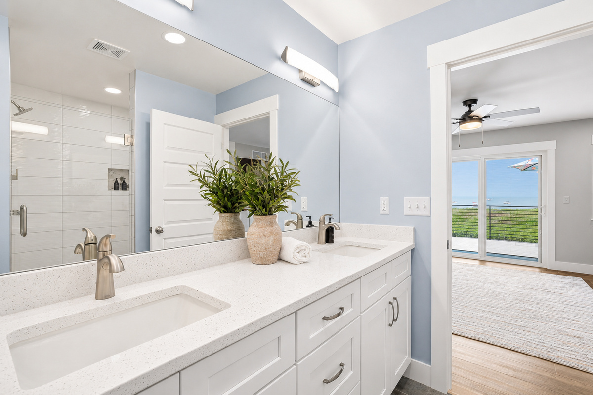 Start your day with ample counter space, dual sinks, and bright, modern lighting designed to make mornings effortless.