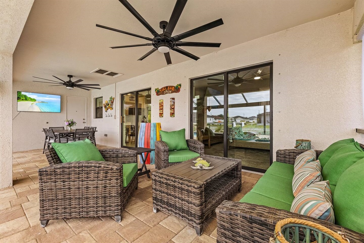Enjoy Florida outdoor living with comfortable seating and an outdoor TV.