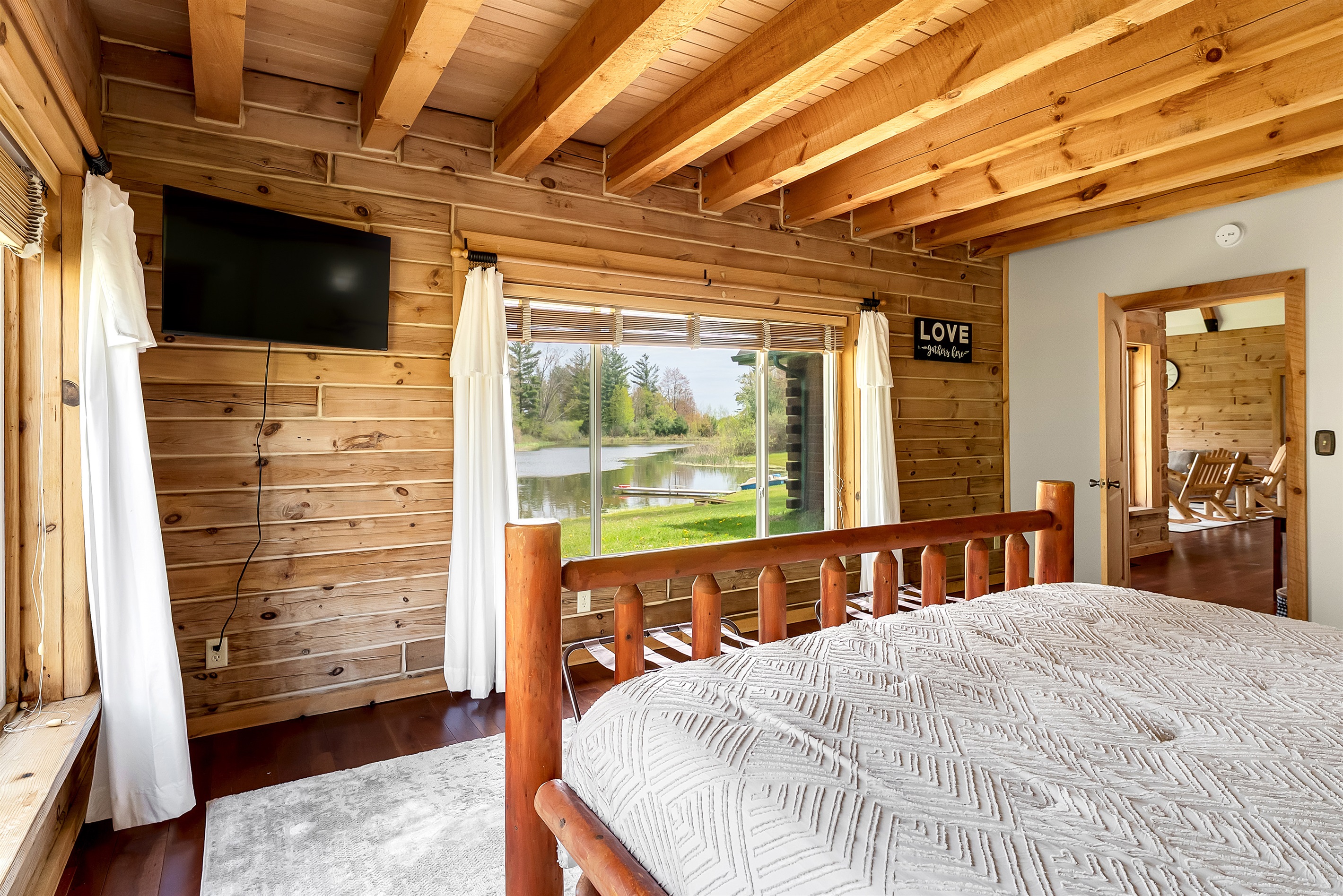 View of the pond from 2nd master bedroom with TV.