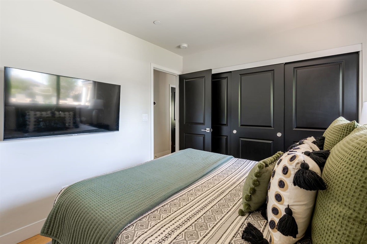 Enjoy plenty of closet space and a wall-mounted Smart TV—perfect for streaming your favorite shows in bed.