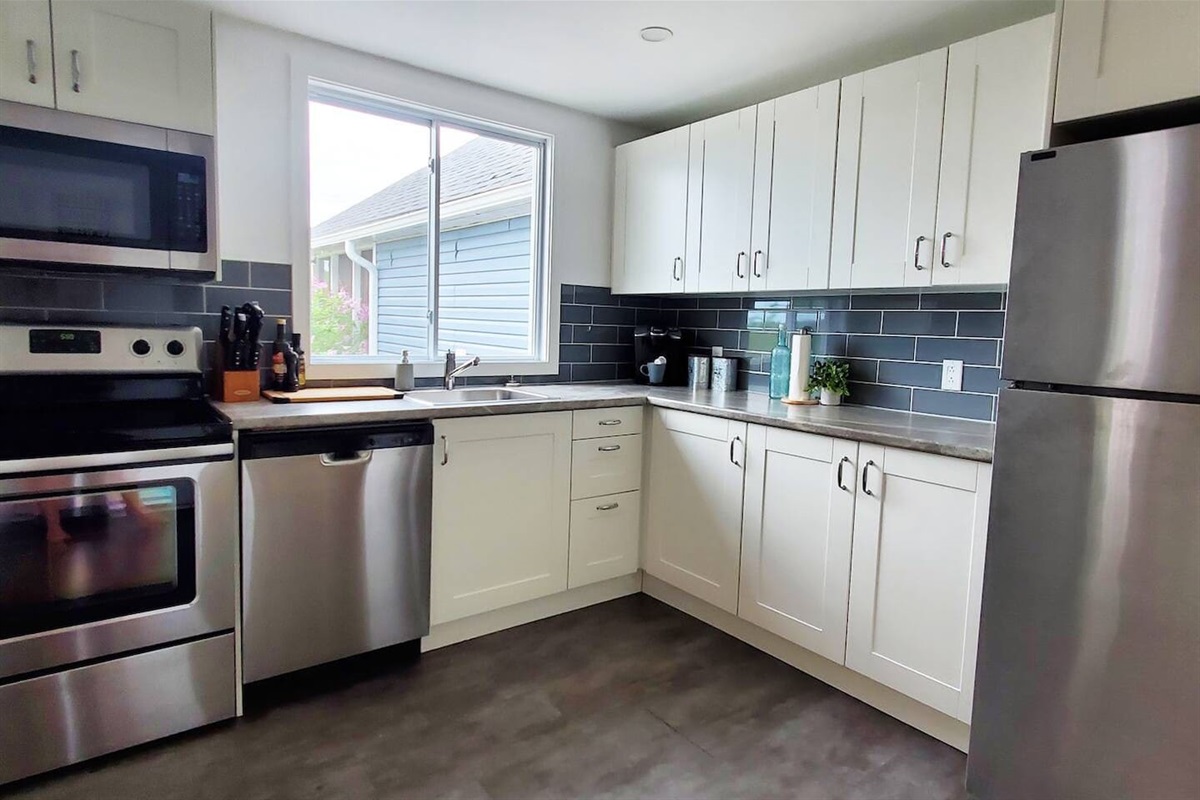 Cuisine parfaitement &eacute;quip&eacute;e - Spacious kitchen equipped with modern appliances