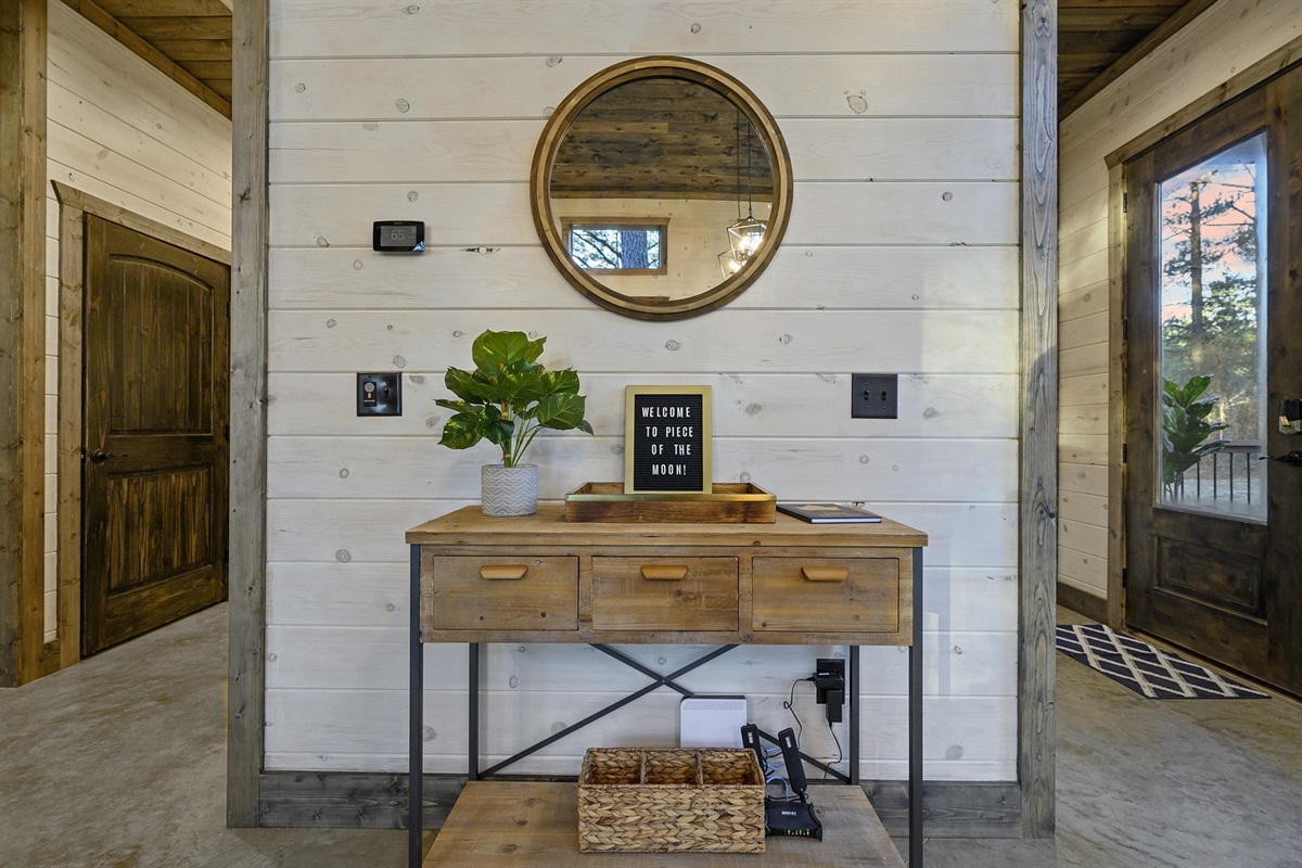 Natural textures and a simple console create a calming welcome. Drop your keys, breathe in the pine, and ease into vacation mode.