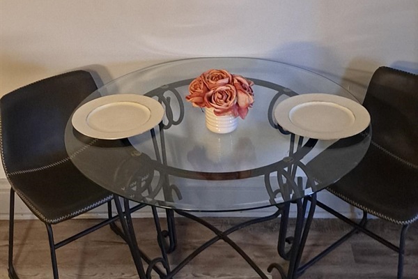 Stylish and efficient—equipped with everything you need to prepare a delicious meal. Features include a stainless steel refrigerator, stove, coffee maker, kitchenette oven, and a cozy eating a