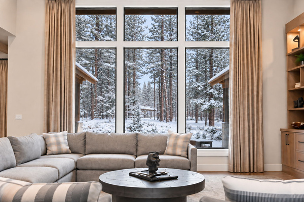 Snowy forest views, a glowing fireplace and plenty of room to settle in after a day outside