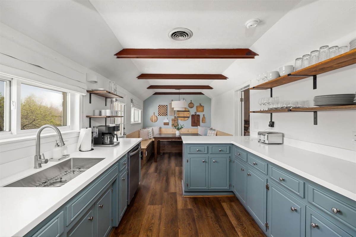The kitchen and breakfast nook overlook the back patio and oversized yard.