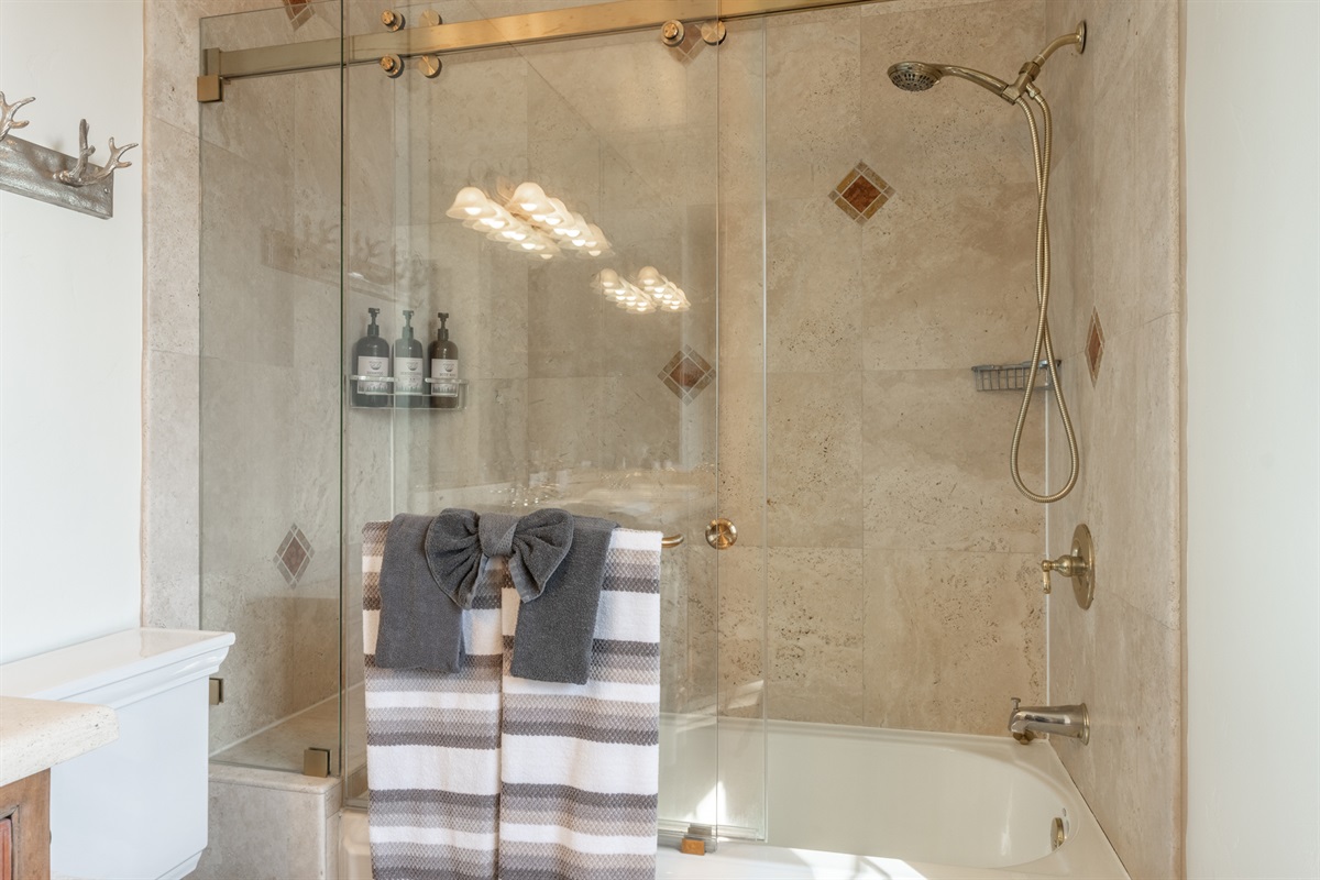 Designed for comfort and convenience, the en-suite bath offers plenty of space for a relaxed morning or evening routine.