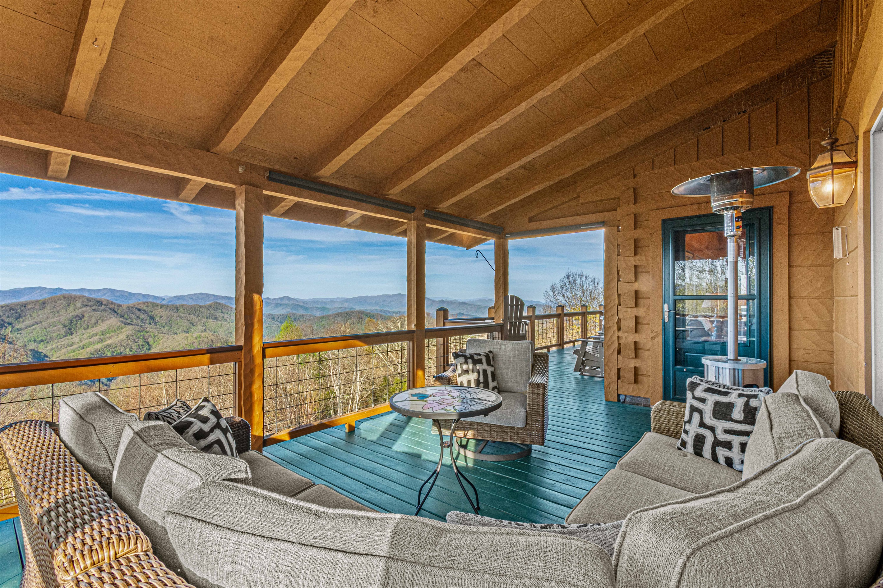 Deck: Enjoy breathtaking views while lounging by the fire in stylish comfort!