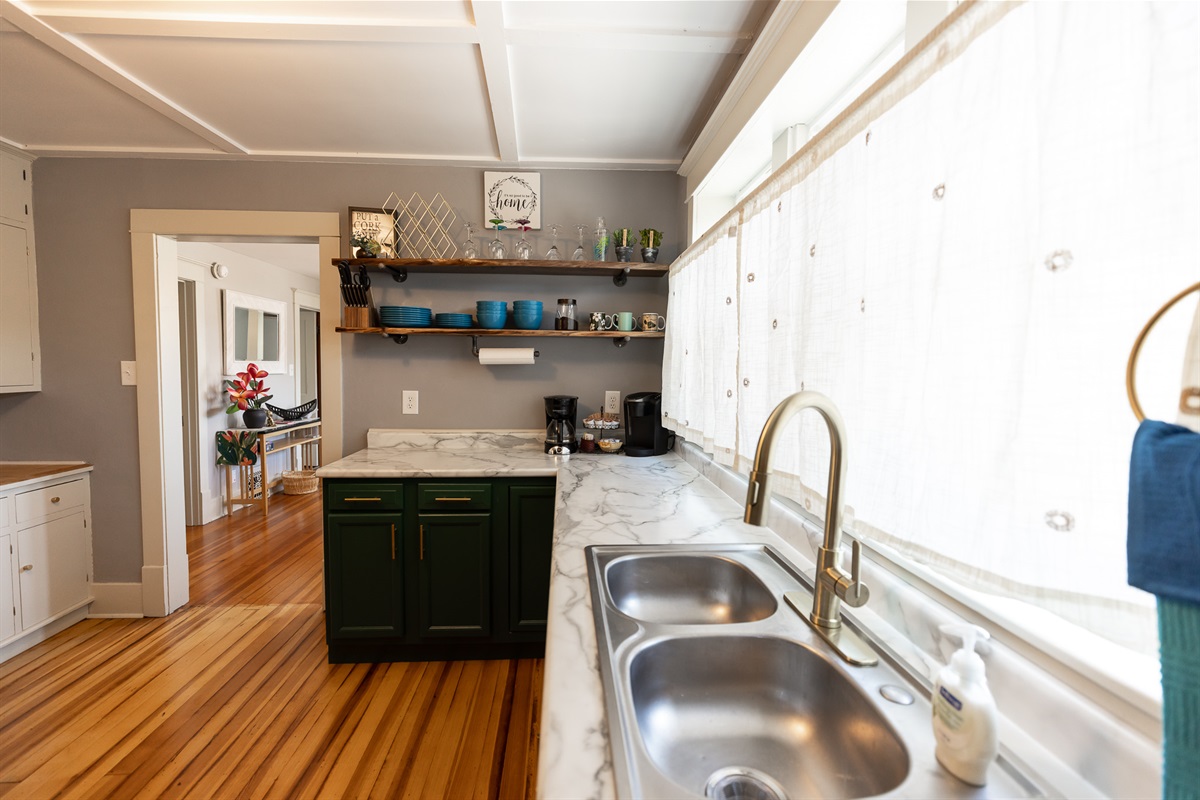Your everyday dishes are easily accessible from the live edge open shelving.
