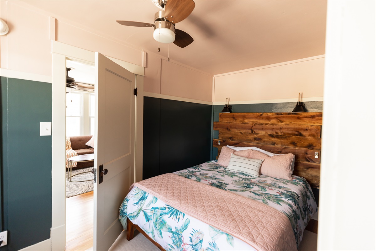 Same bedding setup as the larger back room, in order to fit the queen bed, the door does not open ALL the way. The hardware is original and does not always latch.
