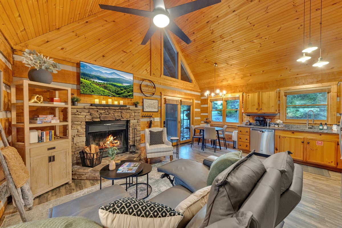 The open-concept design seamlessly connects the living room, dining area, and kitchen