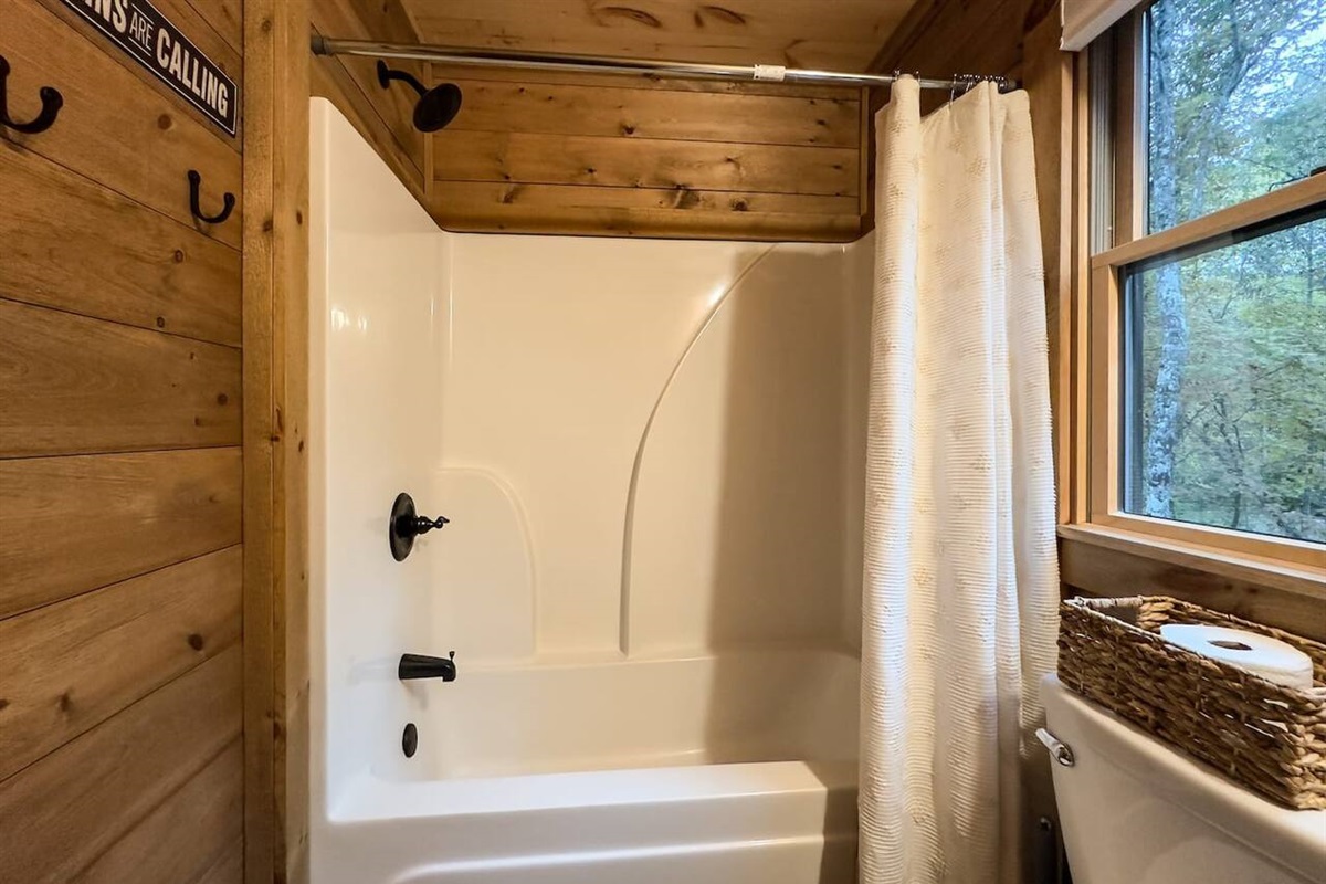 Step into our immaculate bathroom area, where cleanliness reigns supreme, offering a refreshing oasis for relaxation and rejuvenation after a day of adventure