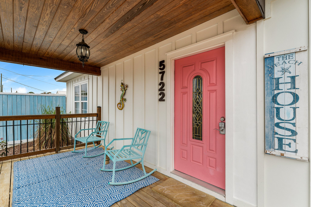 Hot-pink front door — porch view