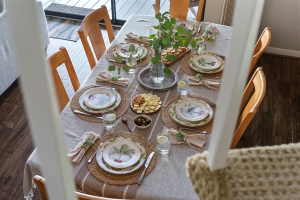 Gather for good food and even better company at this welcoming table, set with care and charm. Whether you’re sharing stories over snacks or sitting down for a family-style meal, this space is made for connection and comfort.