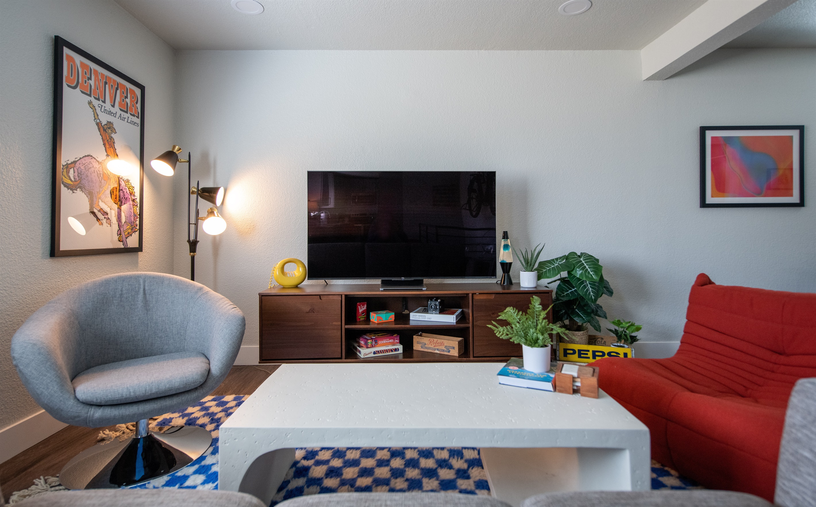 Main living room with Denver-themed mid-century art and furniture