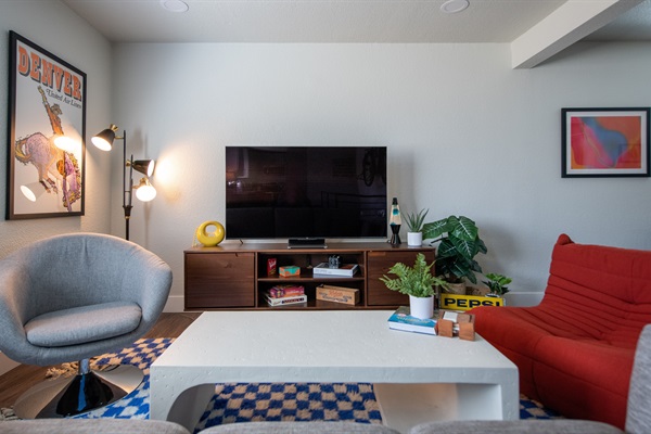 Main living room with Denver-themed mid-century art and furniture