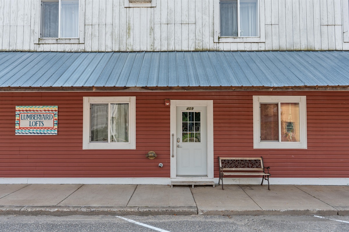 The building's main door leads to Dewdrop Condo.