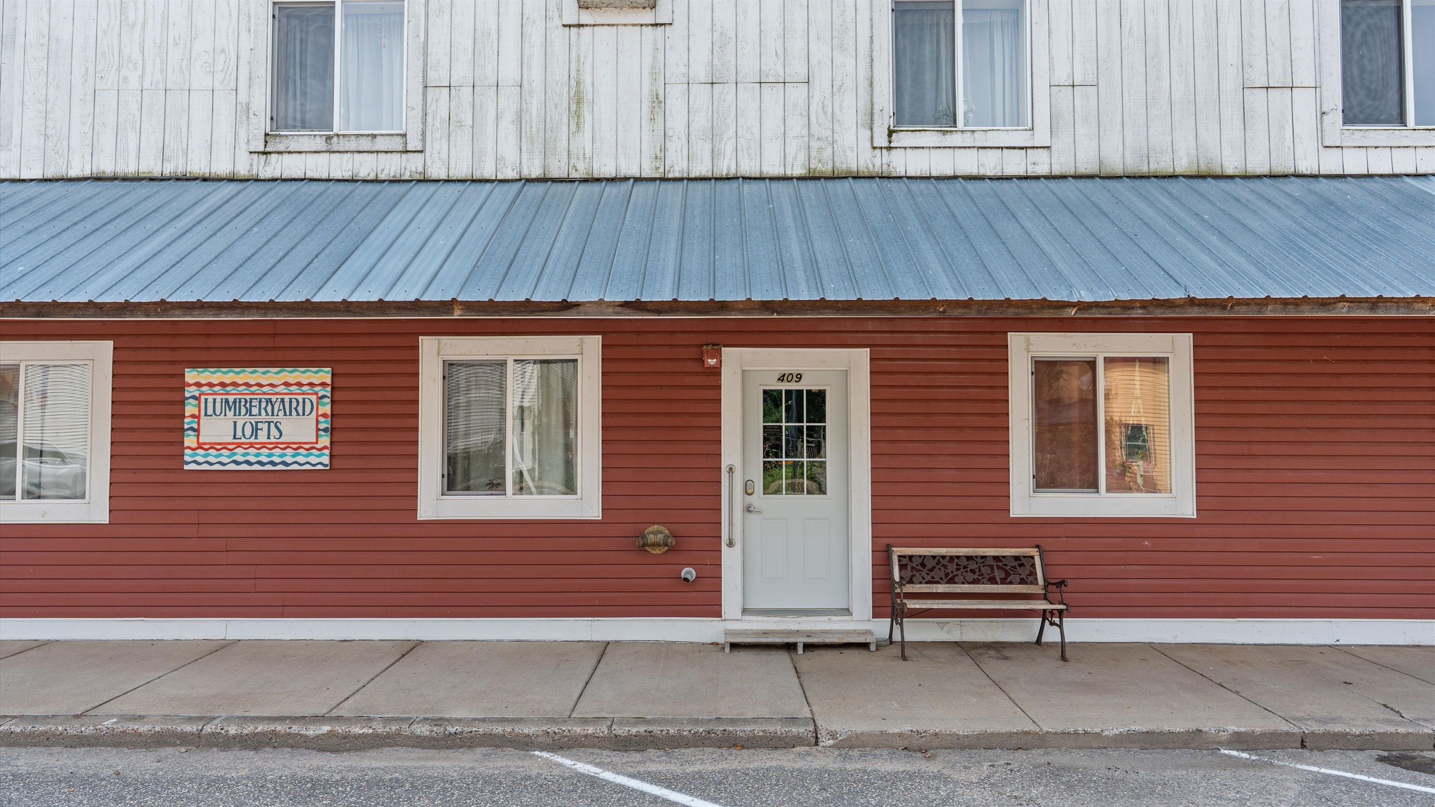 The building's main door leads to Dewdrop Condo.