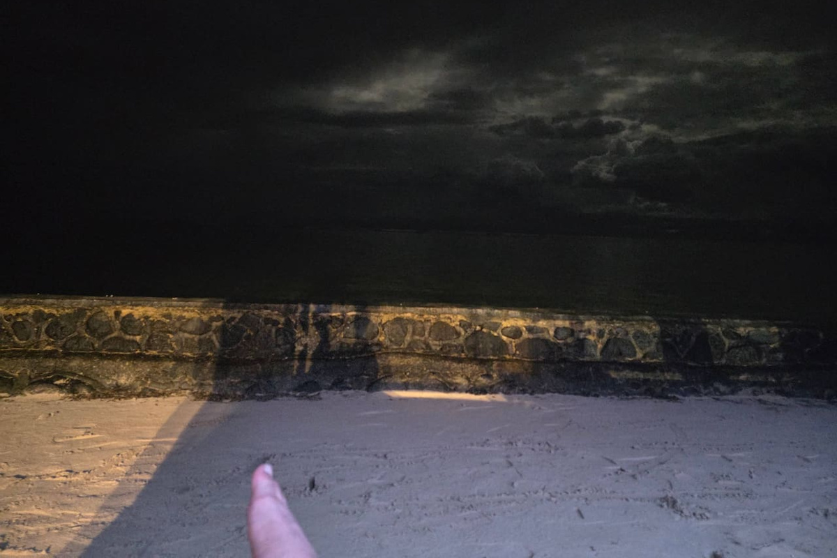 Ethereal Moonrise along with beautiful storm clouds in the ocean. 