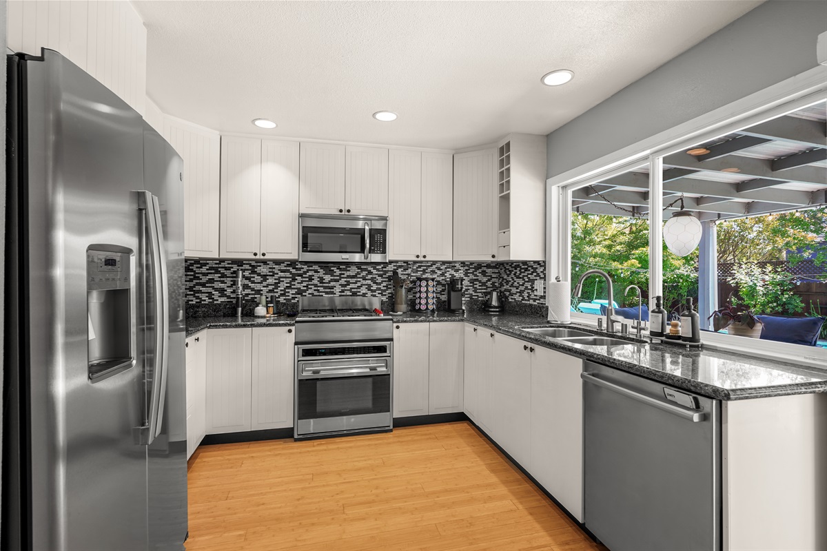 Fully equipped kitchen with modern appliances, ample counter space, and everything needed to prepare meals during your stay.