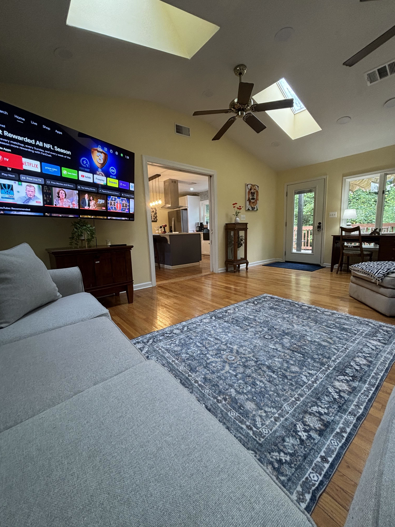 New Living Room: Relax in this bright, open space featuring cozy seating, beautiful views of nature, and a Smart TV.
