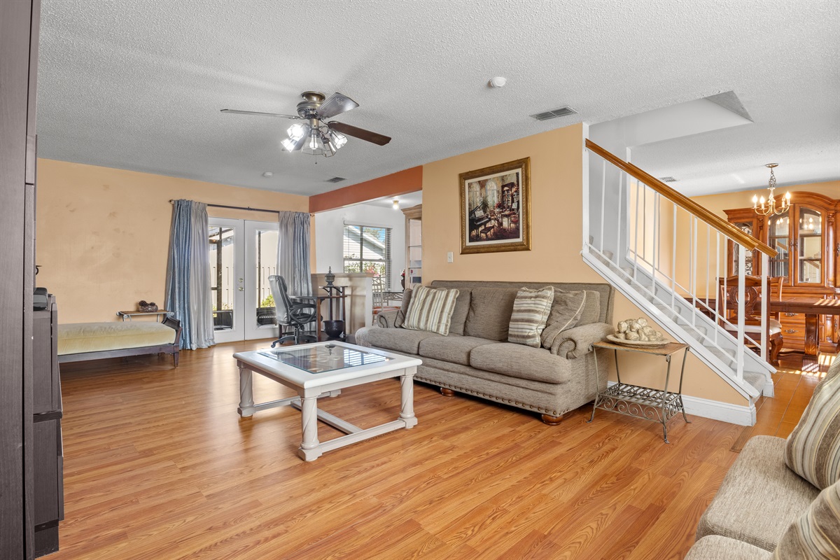 Living room. Back door opens to the exterior screened in lanai.