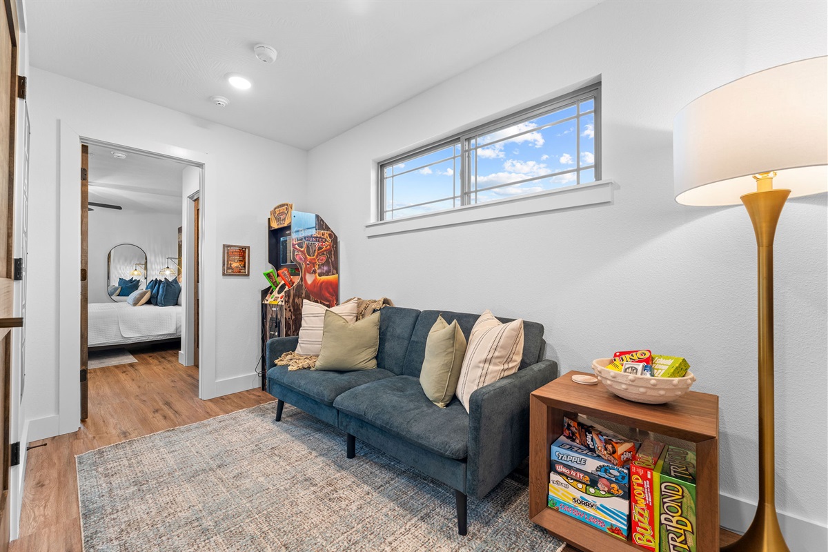 The upstairs loft area includes a king suite bedroom, a comfy sitting area, Buck Hunter game and some classic board games.  A great space to relax and play in. 
