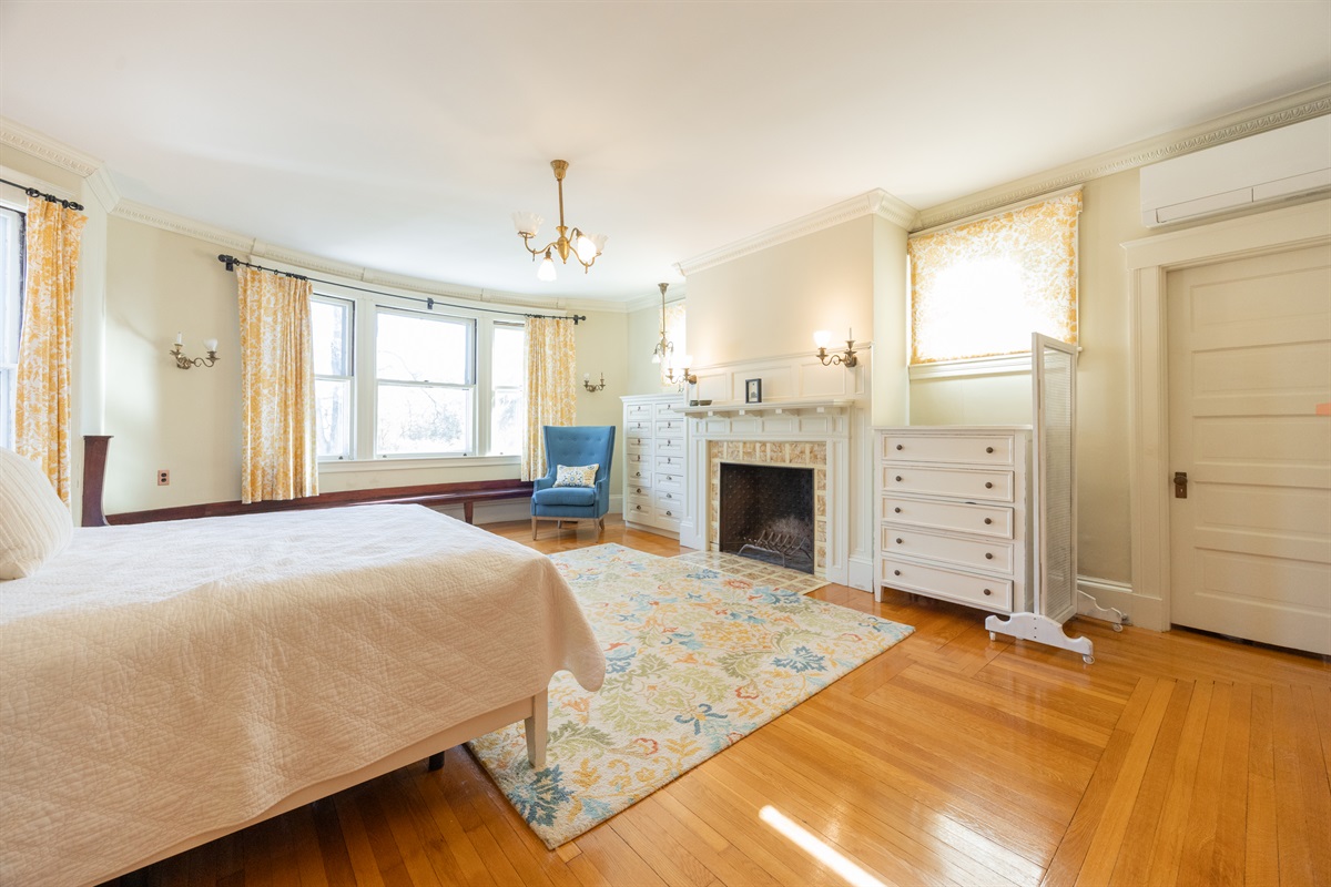 Sleep soundly in the master bedroom with a plush queen-size bed.