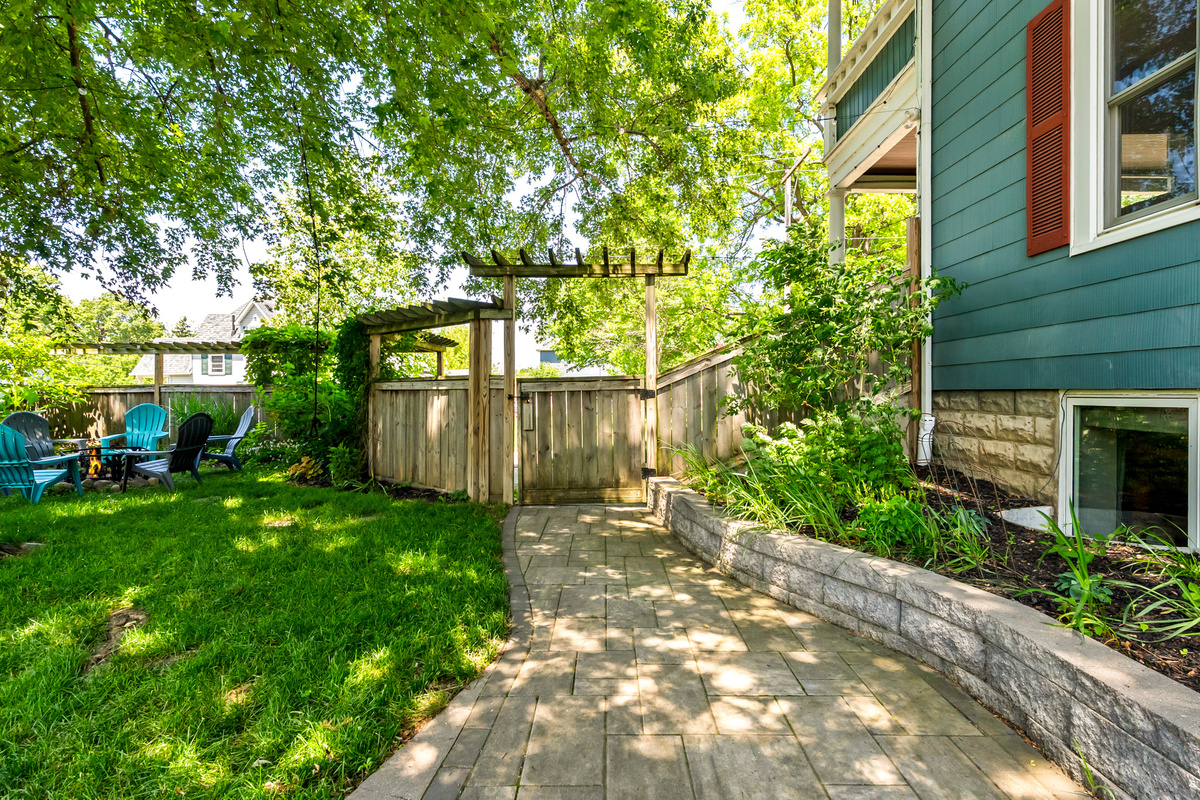 Fully enclosed and worry-free. A beautifully landscaped paver walkway runs alongside our tall privacy fence, ensuring a safe, secure boundary for dogs and kids alike.