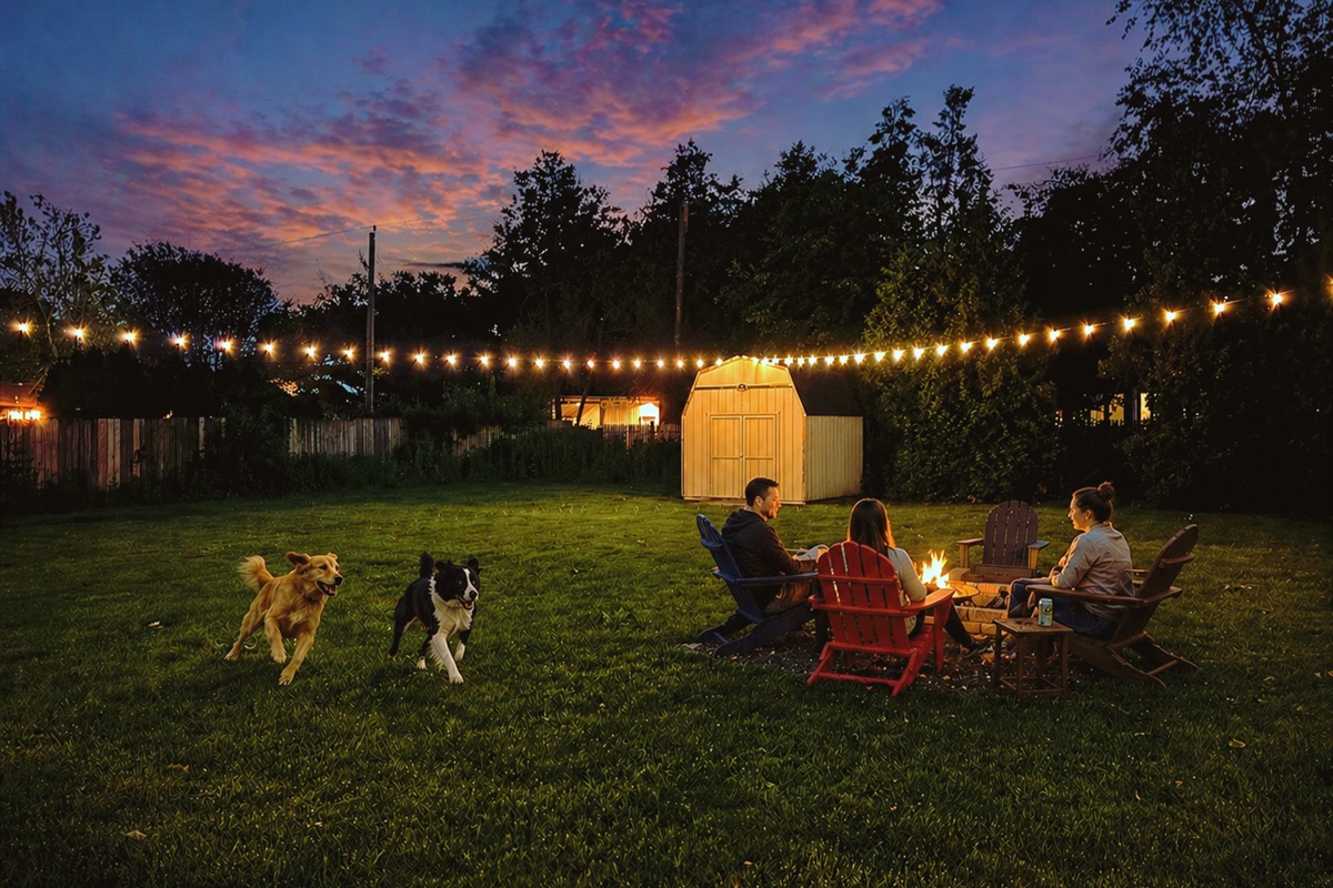 Enjoy fireside nights & a backyard made for everyone, pups included!
