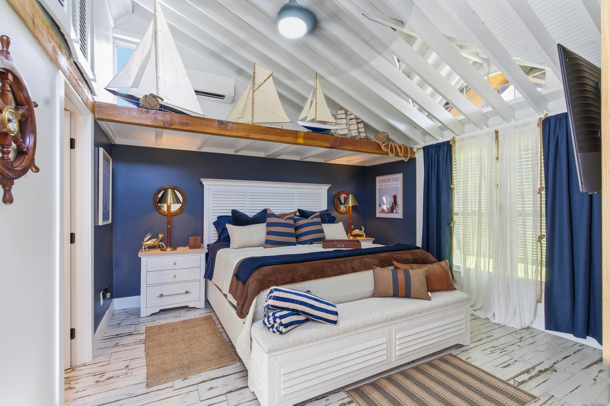 The Sail bedroom is drenched in coastal charm and features a King bed and calming modern luxury.