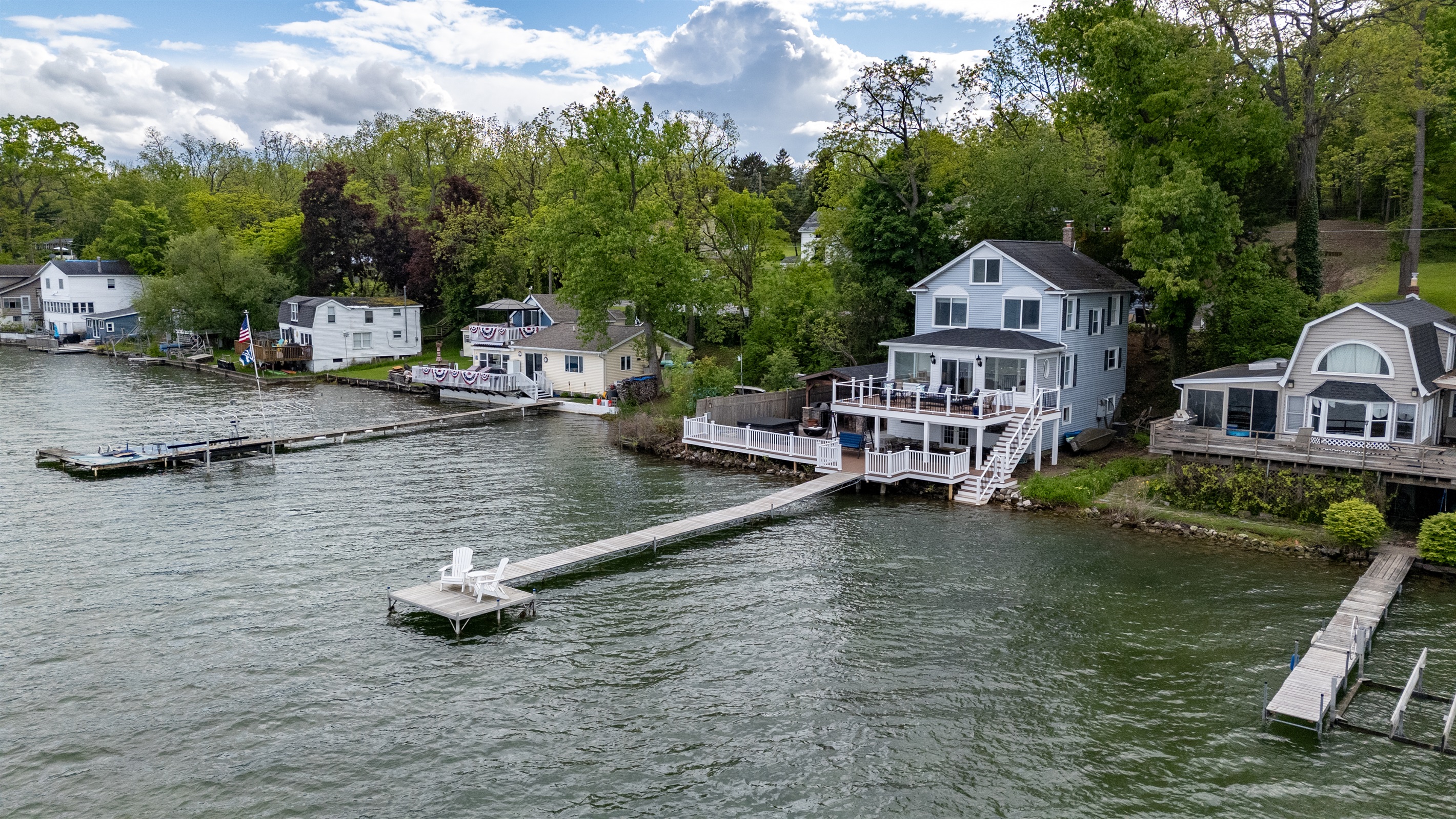 Stunning lakefront home with multi-level decks and a private dock—perfect for sunrise coffees and sunset cocktails 🌅🏡🚤