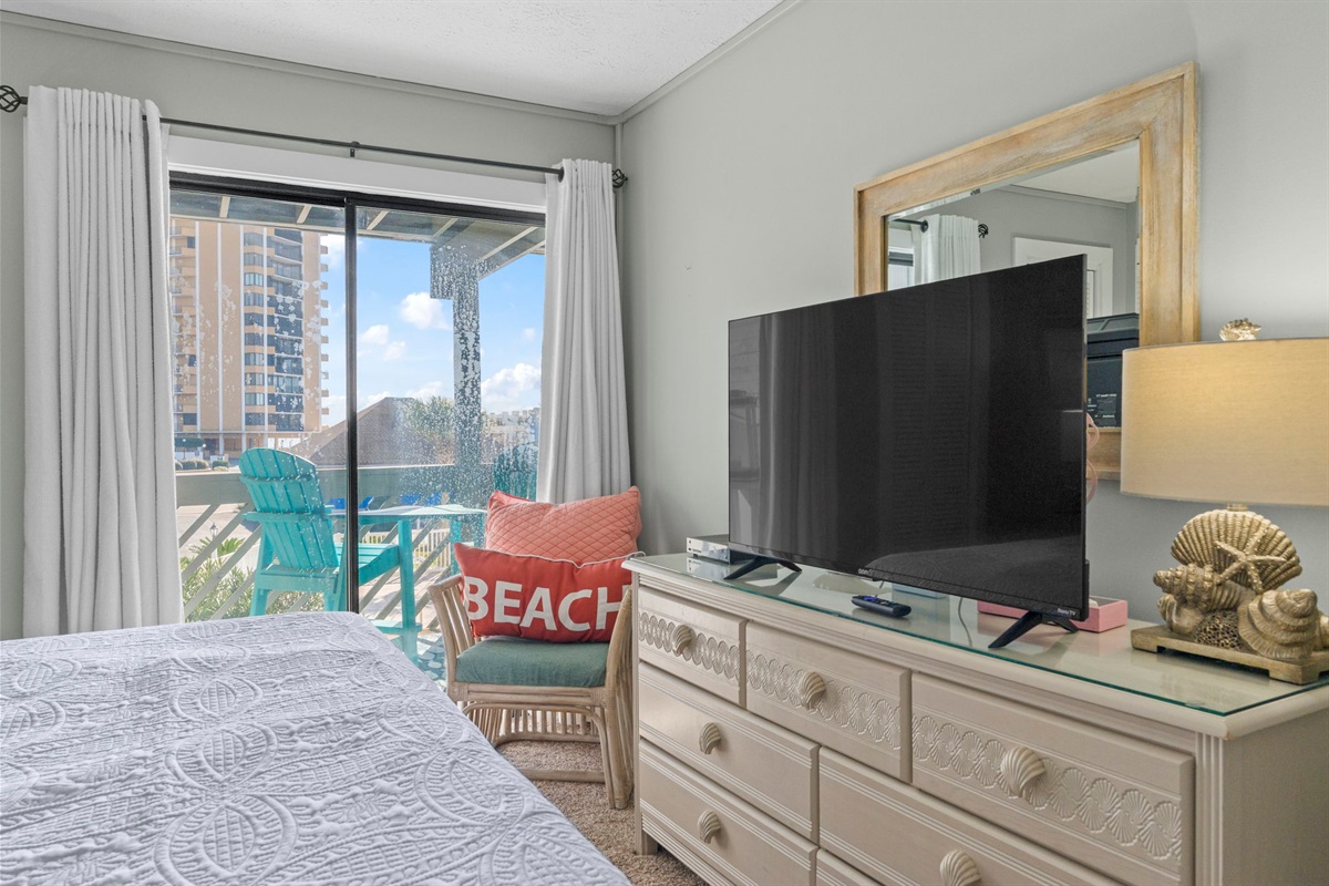 Master Bedroom with private balcony and Smart TV with Ensuite Bathroom