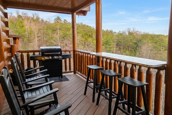 Stretch out on the main deck with rocking chairs, a grill, and a deck bar. An inviting outdoor space for morning coffee, family meals, and quiet evenings.
