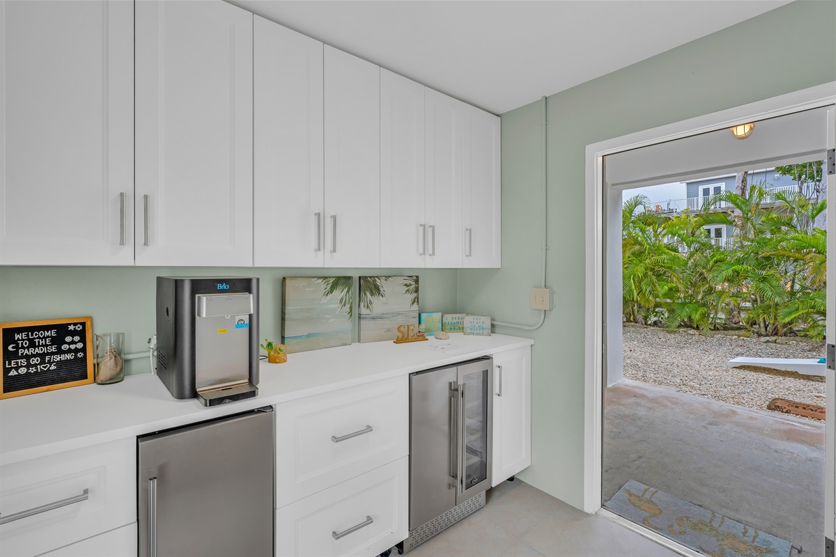 Just inside the front door is a main level vestibule with a beverage cooler and water machine.