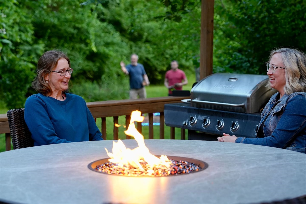 Chat around the table while the rest of your group plays yard games.