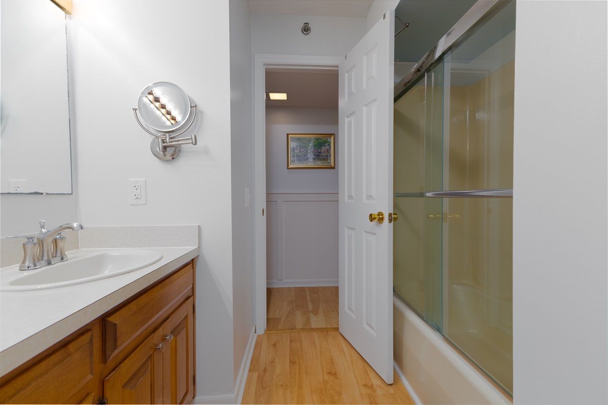 Bright and airy hallway bathroom with vanity