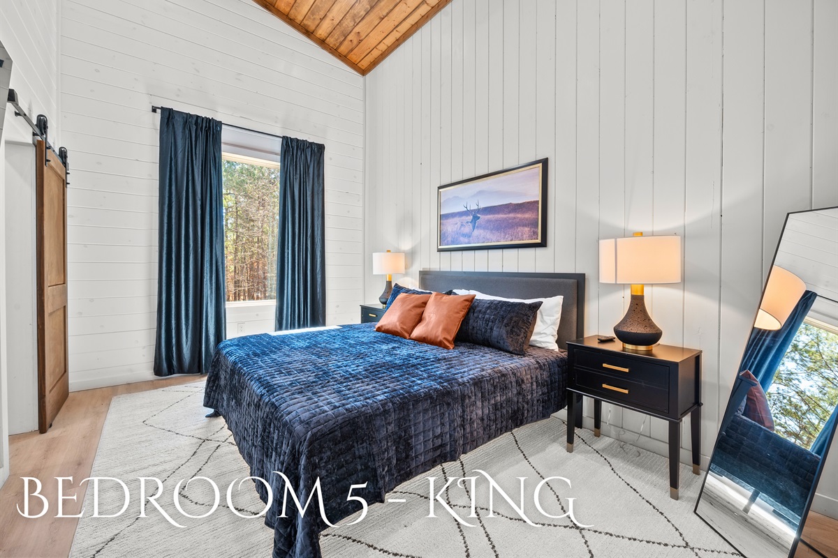 With its inviting color scheme and cozy setup, this king bedroom offers a peaceful space to rest and rejuvenate.