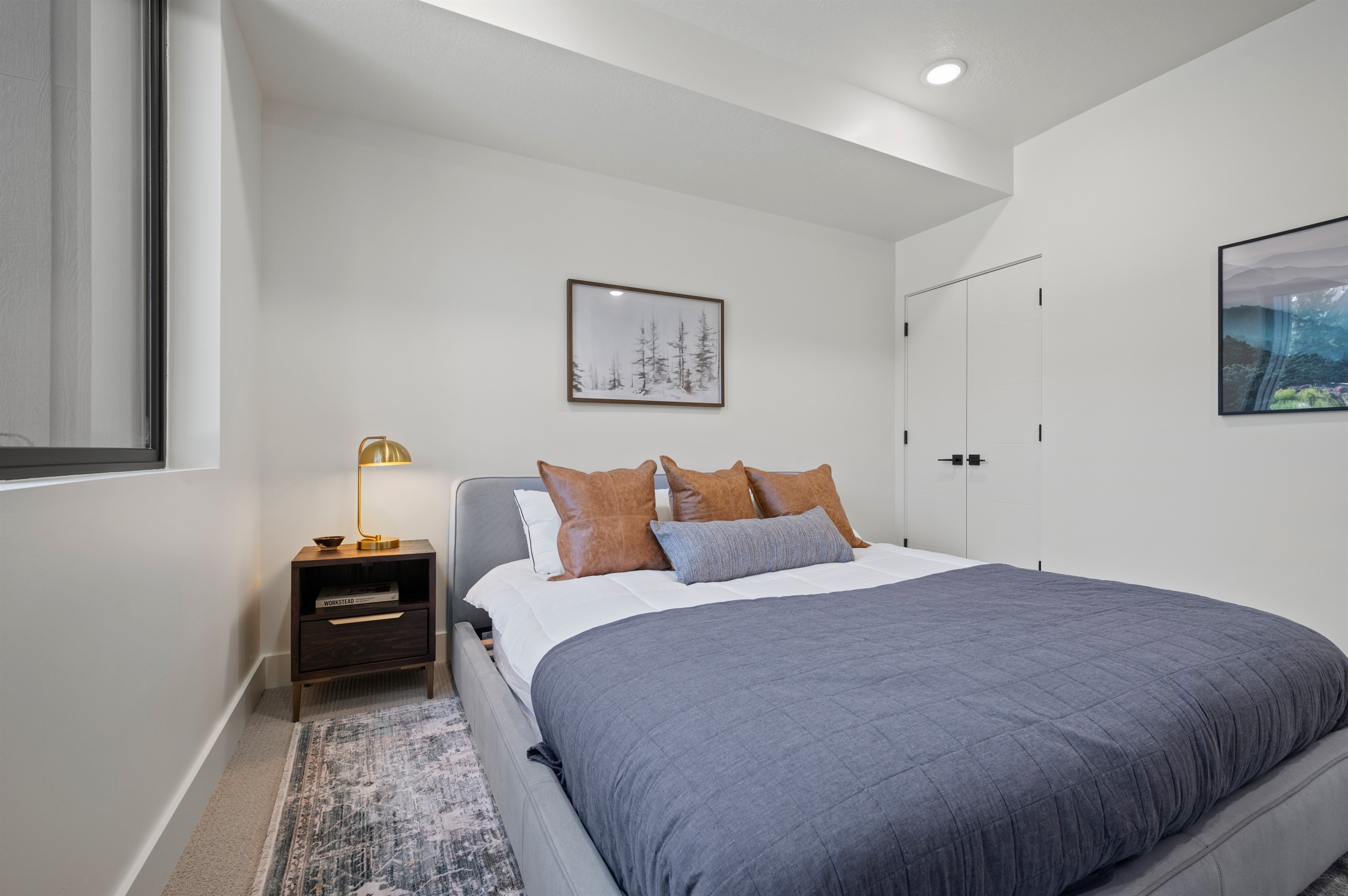 A king bed with plush pillows for comfort.