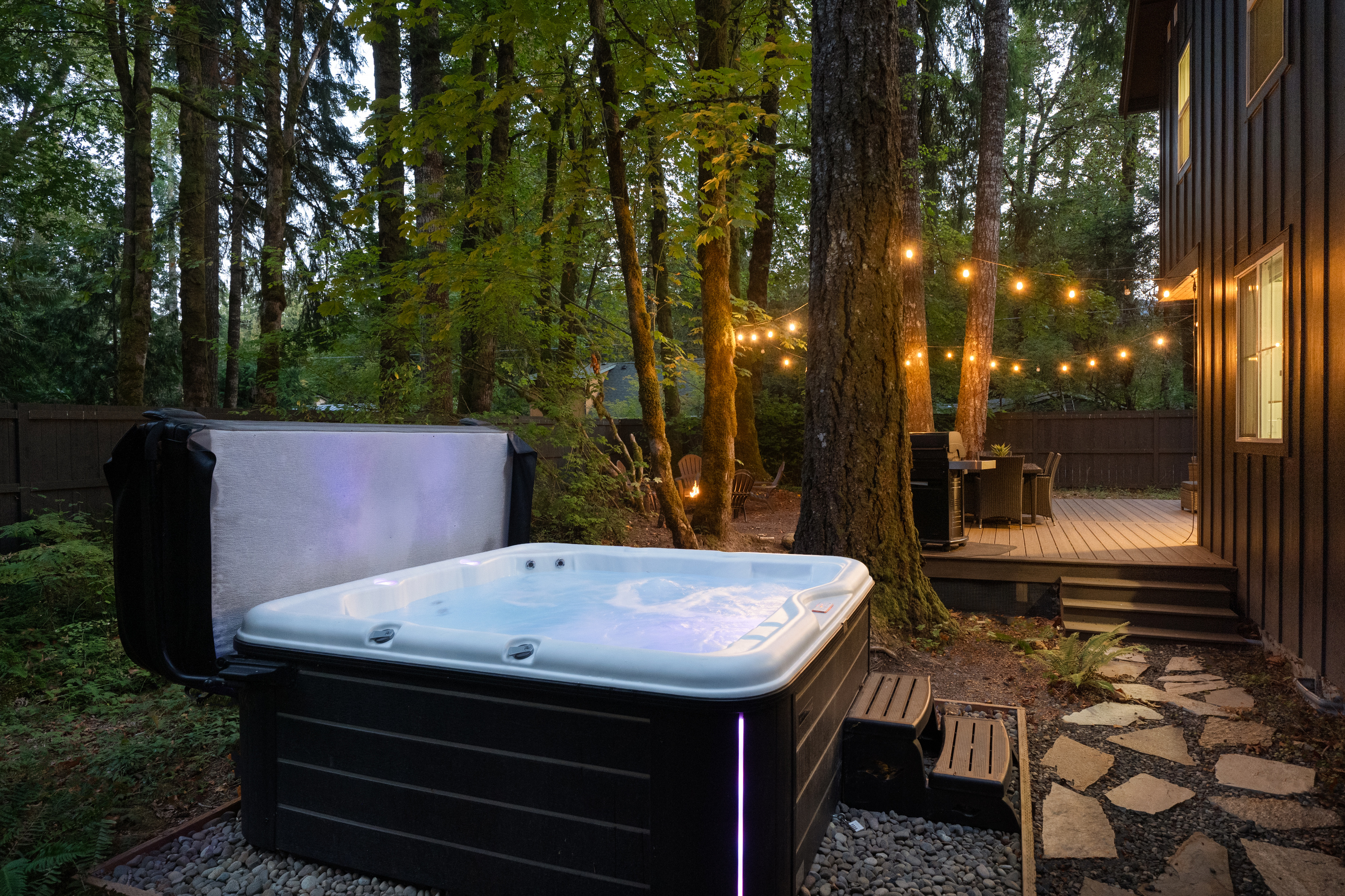 Steam rising, string lights glowing — the hot tub is calling your name.