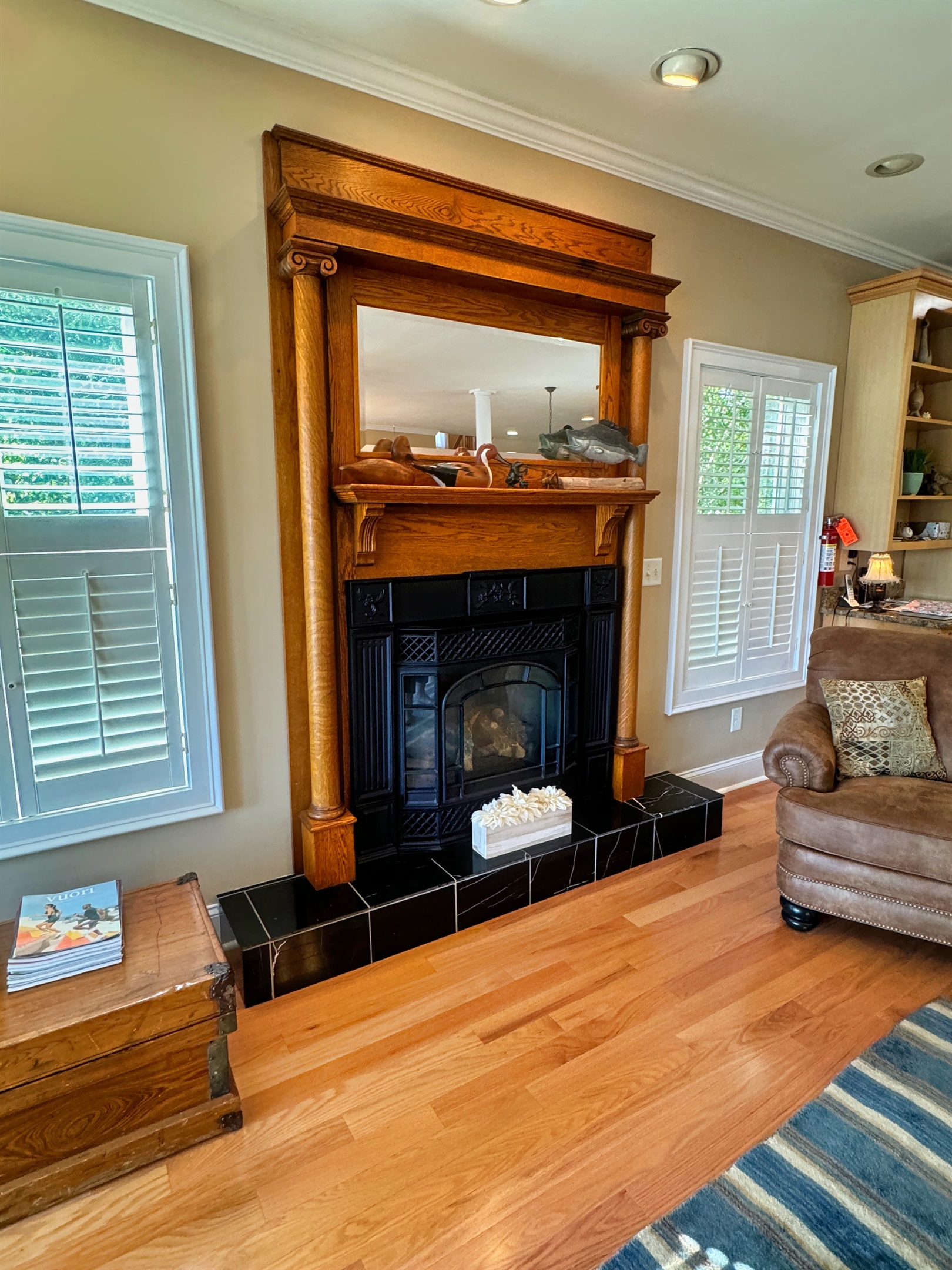 Reclaimed vintage oak fireplace surround adds character