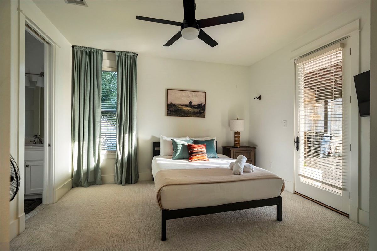 Relaxing guest room with direct access to the pool area and a Jack & Jill bathroom.