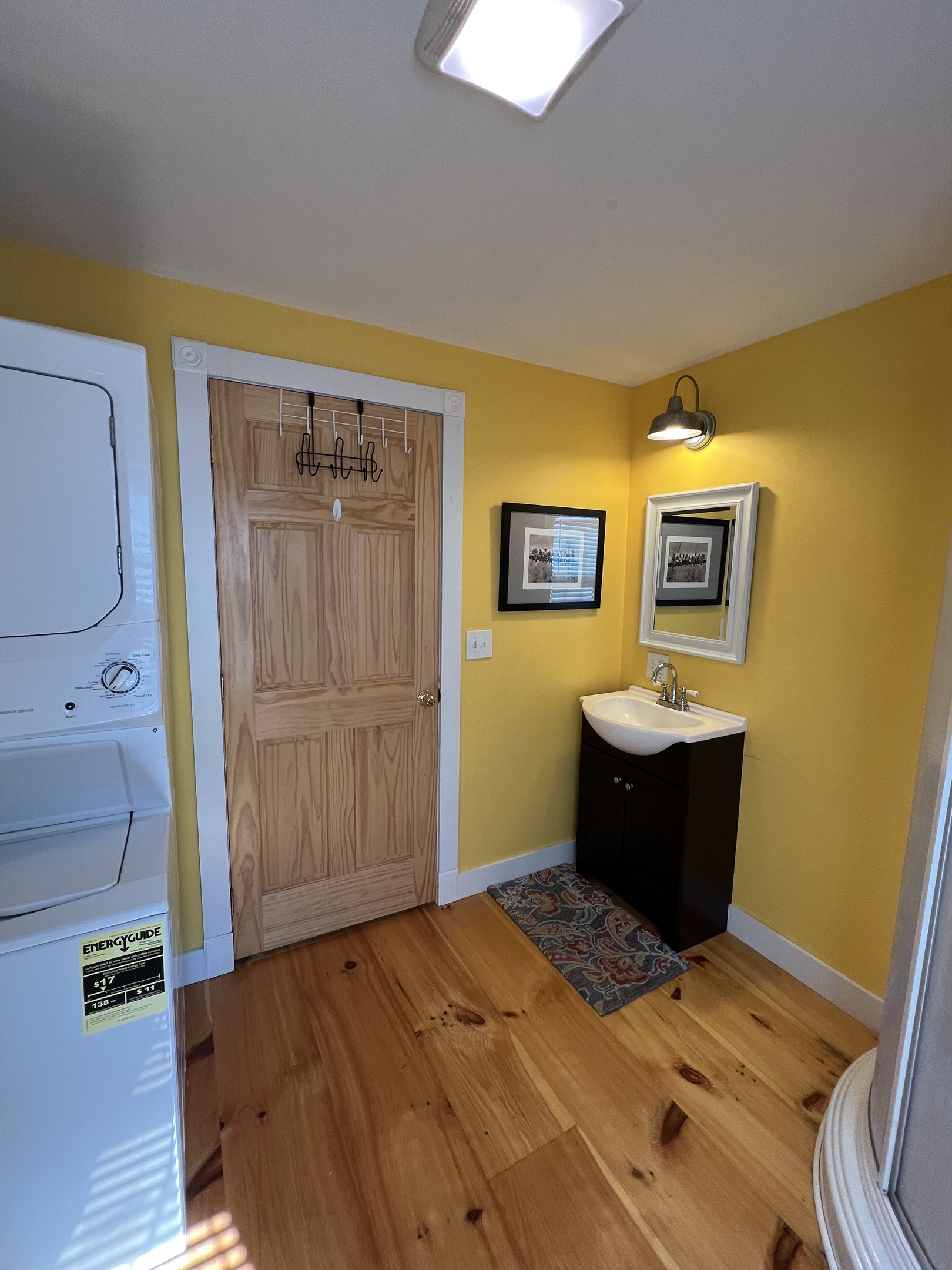 1st floor bathroom off the kitchen, with a shower and laundry area.