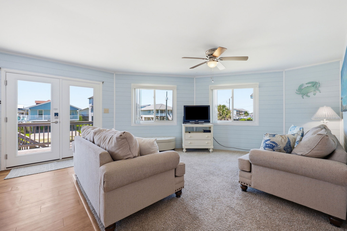 Gather together in this bright and welcoming living area