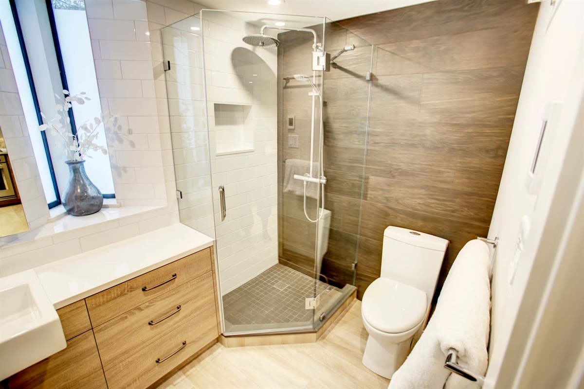 Bathroom#1- Walk-in shower includes a massive rain can shower head for a truly luxurious shower experience.  Double Hot water tanks ensure an endless supply of hot water.  Heated floors. Body wash, shampoo and conditioner provided.  Hair dryer 