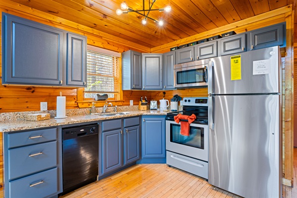 Stocked kitchen with newly upgraded refrigerator 