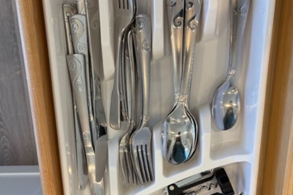 Fully stocked kitchen utensils and flatware