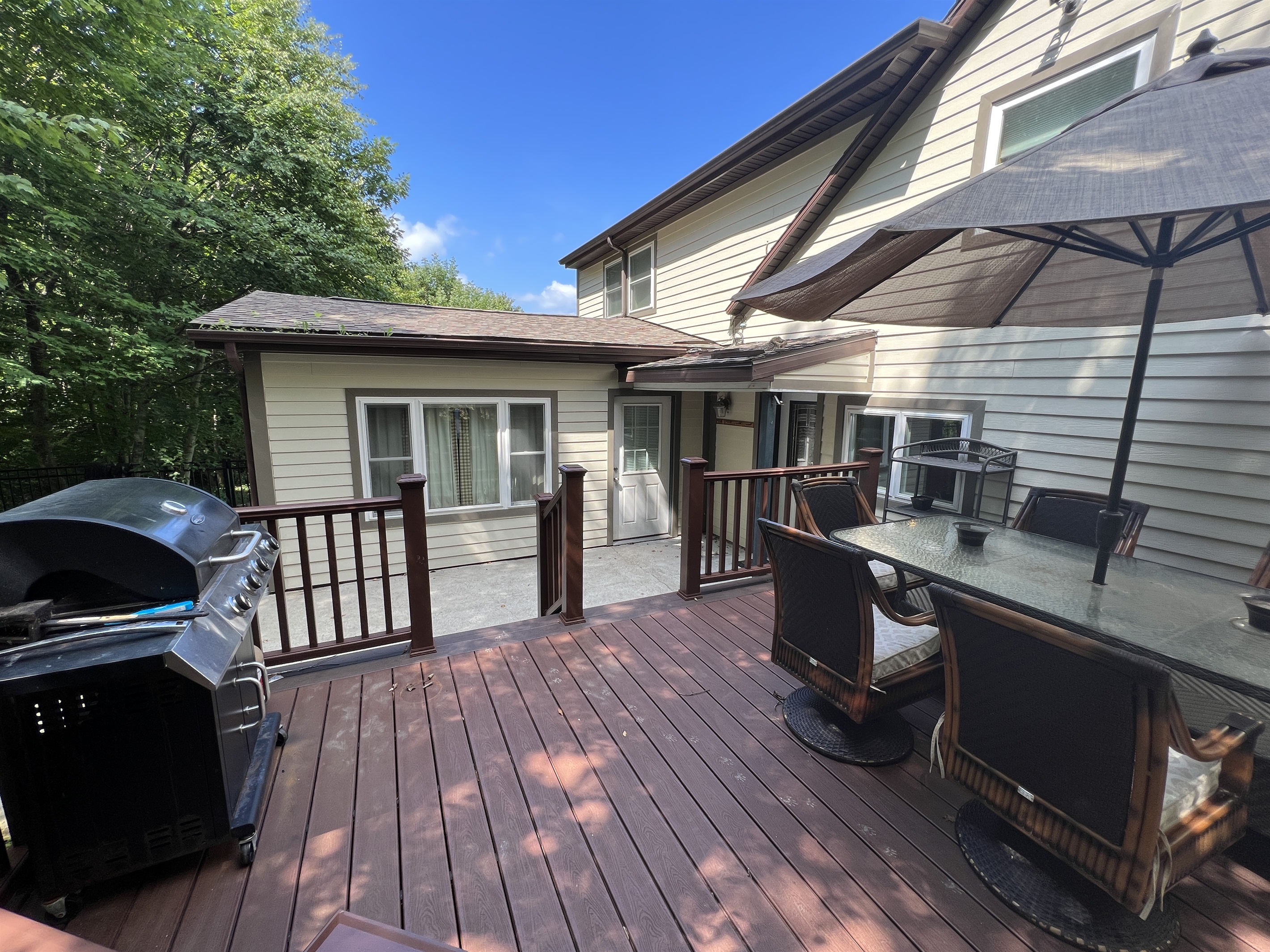 Deck off of the kitchen with gas grill.