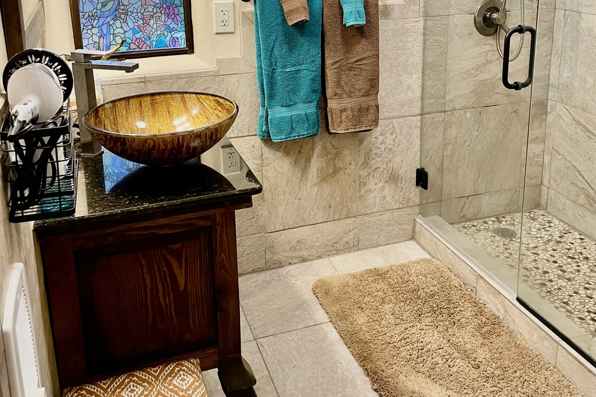 Relax and rejuvenate in this beautifully remodeled bathroom.