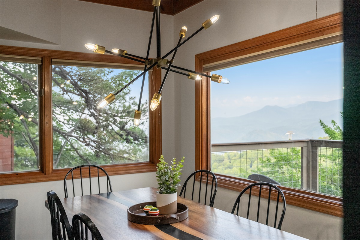 Dining table for 8 with a view, with seating for 6 more on secondary table nearby